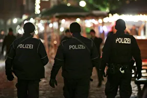 German police officers guard a Christmas market in the Prenzlauer Berg district in Berlin German police officers guard a Christmas market in the Prenzlauer Berg district in Berlin