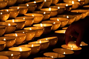 A hand is seen lighting a candle during mass at St. Marys Cathedral in Dublin A hand is seen lighting a candle during mass at St. Marys Cathedral in Dublin