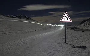 The headlight of a musher is pictured during the tenth stage of La Grande Odyssee sled The headlight of a musher is pictured during the tenth stage of La Grande Odyssee sled