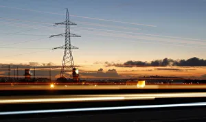 High-voltage power lines are seen next to highway of Puchuncavi city High-voltage power lines are seen next to highway of Puchuncavi city