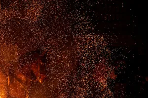 A horse is seen through flames during the annual Luminarias celebration on the eve of A horse is seen through flames during the annual Luminarias celebration on the eve of