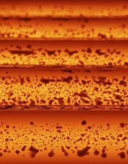 Hot steel bars are processed at a factory belonging to Ezz Steel at an industrial Hot steel bars are processed at a factory belonging to Ezz Steel at an industrial