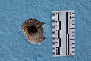 The impact from a bullet is seen on a wall on the rue du Savon after the deadly shooting The impact from a bullet is seen on a wall on the rue du Savon after the deadly shooting
