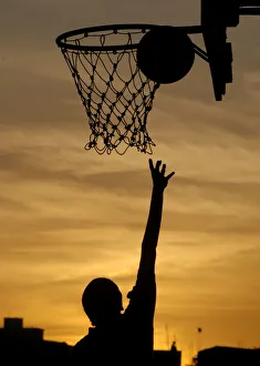 An Indian girl plays basketball in the evening in Chennai An Indian girl plays basketball in the evening in Chennai