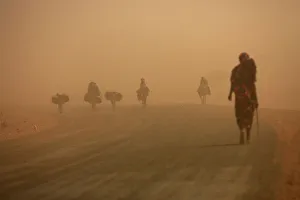 Internally displaced people ride donkeys during a sandstorm outside ZamZam IDPs camp Internally displaced people ride donkeys during a sandstorm outside ZamZam IDPs camp