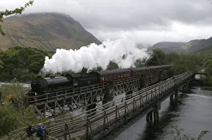 The Jacobite steam train crosses the river Lochy as it departs Fort William, Scotland The Jacobite steam train crosses the river Lochy as it departs Fort William, Scotland