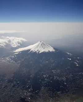 Japans Mount Fuji is seen covered with snow from an airplane Japans Mount Fuji is seen covered with snow from an airplane