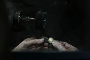 A jeweller smoothens a gold medal at his workshop in central Madrid A jeweller smoothens a gold medal at his workshop in central Madrid
