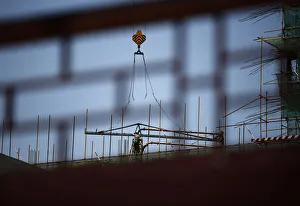 A labourer works at a construction site in Beijing A labourer works at a construction site in Beijing