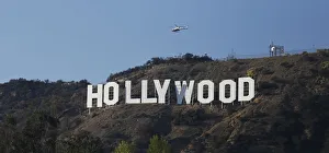 A LAPD helicopter flies over the Hollywood sign in Hollywood A LAPD helicopter flies over the Hollywood sign in Hollywood
