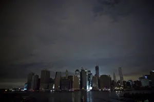 A largely unlit downtown Manhattan stands under a night sky due to a power blackout A largely unlit downtown Manhattan stands under a night sky due to a power blackout