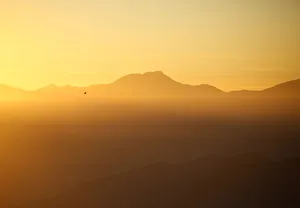 Light illuminates the mountain range and hills during the sunrise over the Nagarkot Light illuminates the mountain range and hills during the sunrise over the Nagarkot