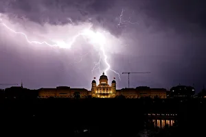 Lightning illuminates the sky above the Swiss Federal Palace in Bern Lightning illuminates the sky above the Swiss Federal Palace in Bern