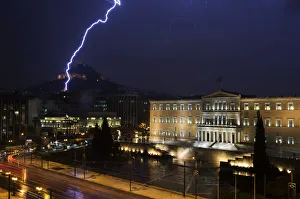 Lightning strikes near the Greek parliament building during heavy rainfall in Athens Lightning strikes near the Greek parliament building during heavy rainfall in Athens