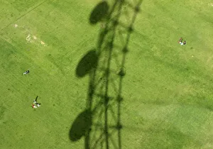 The London Eye casts a shadow on Jubilee Gardens in London The London Eye casts a shadow on Jubilee Gardens in London