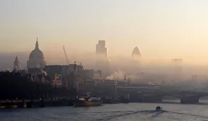 Londons skyline is seen beyond the river Thames from Waterloo Bridge Londons skyline is seen beyond the river Thames from Waterloo Bridge