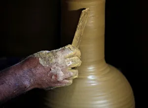 A man makes a clay pot at his workshop in Biyagama A man makes a clay pot at his workshop in Biyagama