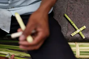 Man makes crosses made out of palm fronds for the oncoming Palm Sunday in Tegucigalpa Man makes crosses made out of palm fronds for the oncoming Palm Sunday in Tegucigalpa