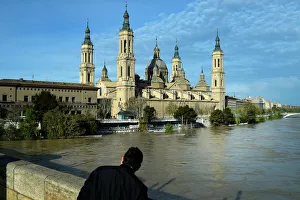 A man observes the River Ebro close to overflowing, following heavy rains and snow melt A man observes the River Ebro close to overflowing, following heavy rains and snow melt