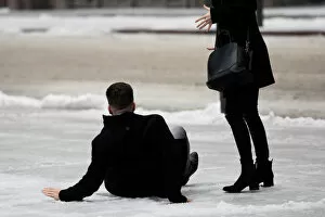 Kang Collection: A man slips on icy snow covered sidewalk as freezing rain falls in Toronto