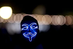 A man wears an anonymous mask on the fourth and final day of the Firefly Music Festival A man wears an anonymous mask on the fourth and final day of the Firefly Music Festival