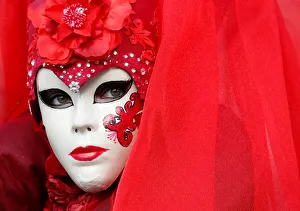 A masked reveller poses during the Venice Carnival in Venice A masked reveller poses during the Venice Carnival in Venice