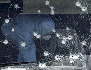 A member of Afghan security force inspects at the site of a suicide attack in Kabul A member of Afghan security force inspects at the site of a suicide attack in Kabul
