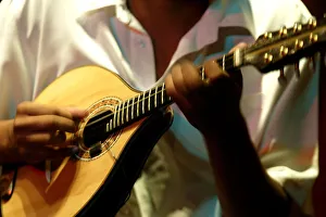 A member of Choros Scenarium group plays a Mamdolin guitar at Scenarium bar in Rio de A member of Choros Scenarium group plays a Mamdolin guitar at Scenarium bar in Rio de