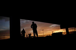 Members of the Mexican National Guard stand near the border fence between Mexico Members of the Mexican National Guard stand near the border fence between Mexico