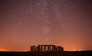 A meteor streaks past stars in the night sky over Stonehenge in Salisbury Plain A meteor streaks past stars in the night sky over Stonehenge in Salisbury Plain