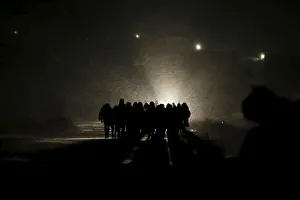 Migrants walk along a road after crossing the border from Macedonia, at Miratovac, Serbia Migrants walk along a road after crossing the border from Macedonia, at Miratovac, Serbia