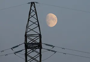 The moon rises behind a power line near the Chernobyl Nuclear Power Plant in Chernobyl The moon rises behind a power line near the Chernobyl Nuclear Power Plant in Chernobyl