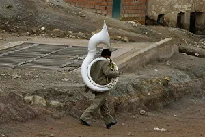 A musician walks by during the miners carnival near Cerro Rico in Potosi A musician walks by during the miners carnival near Cerro Rico in Potosi
