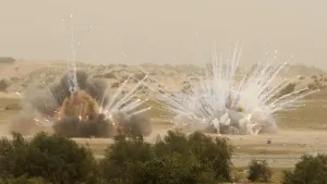 Prints of Explosions are seen while members of Hamas security forces and and members of a United Nations sapper unit work on neutralizing an unexploded ordnance remaining from Israels offensive last year Palestinian Prints: Print of Explosions near Hamas Forces in Gaza Strip