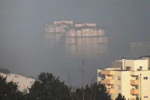 Prints of Residential buildings are seen amid morning smog in Pristina January 30, 2018. Picture taken January 30, 2018. REUTERS/Hazir Reka Kosovo Prints: Print of Residential buildings in Pristina shrouded by morning smog