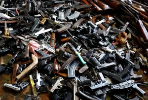 Print of Weapons and Drugs Displayed in a Nickel Plant