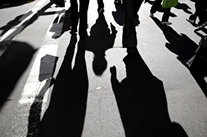 Office workers rush across a city street in central Sydney Office workers rush across a city street in central Sydney