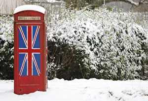 An old telephone box painted with the Union Flag stands out in the snow at Staplefield An old telephone box painted with the Union Flag stands out in the snow at Staplefield