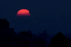 A partial eclipse of the sun, as it sets, is seen from Shanghai A partial eclipse of the sun, as it sets, is seen from Shanghai