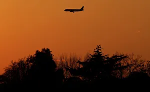 A passenger aircraft prepares to land at Fiumicino International airport in Rome A passenger aircraft prepares to land at Fiumicino International airport in Rome