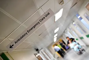 A patient is pushed down a corridor in Frimley Park Hospital near Camberley A patient is pushed down a corridor in Frimley Park Hospital near Camberley