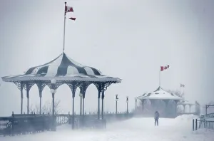 A pedestrian walks on the Terrasse Dufferin during a snowstorm in Quebec City A pedestrian walks on the Terrasse Dufferin during a snowstorm in Quebec City