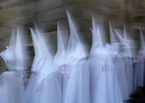 Penitents take part in the procession of the Espiritu Santo brotherhood during Holy Penitents take part in the procession of the Espiritu Santo brotherhood during Holy