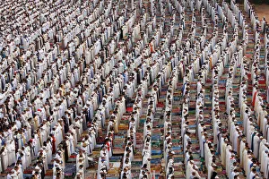 People attend Eid al-Fitr prayers to mark the end of the holy fasting month of Ramadan at People attend Eid al-Fitr prayers to mark the end of the holy fasting month of Ramadan at