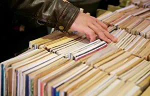 People browse books at secondhand partition with old newspapers People browse books at secondhand partition with old newspapers
