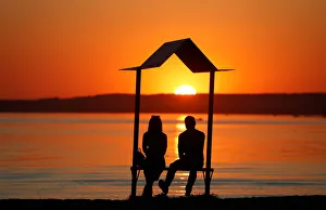 People enjoy sunset at a lake on the outskirts of Minsk People enjoy sunset at a lake on the outskirts of Minsk