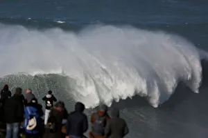People gather to watch the Nazare Challenge championship at Praia do Norte in Nazare People gather to watch the Nazare Challenge championship at Praia do Norte in Nazare