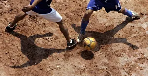 People practice soccer in a slum on outskirts of Sao Paulo People practice soccer in a slum on outskirts of Sao Paulo