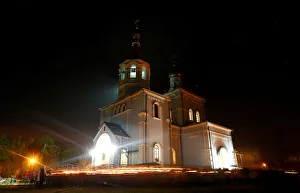 People take part in a procession as they celebrate Orthodox Easter in the town of People take part in a procession as they celebrate Orthodox Easter in the town of