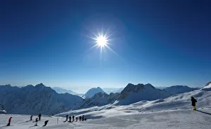 People skiing at Zugspitzplatt on top of the highest German mountain, the Zugspitze People skiing at Zugspitzplatt on top of the highest German mountain, the Zugspitze